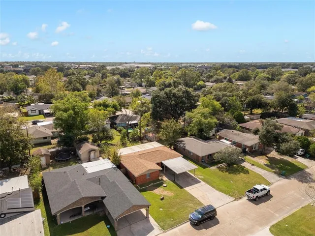 an aerial view of a house with a swimming pool