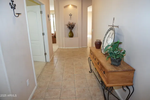 a kitchen with stainless steel appliances granite countertop a sink and a white cabinets