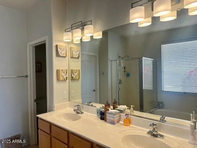 a bedroom with a bed and a lamp