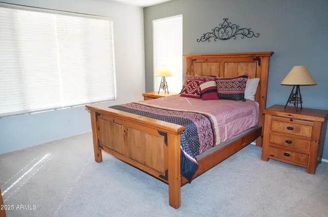 a bedroom with a bed and a dresser