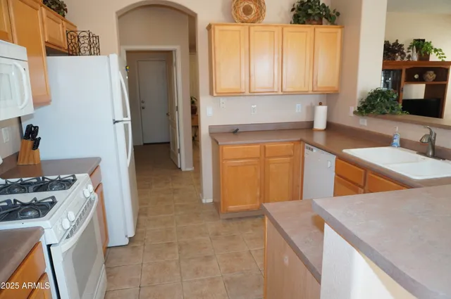 a view of a backyard with sitting area