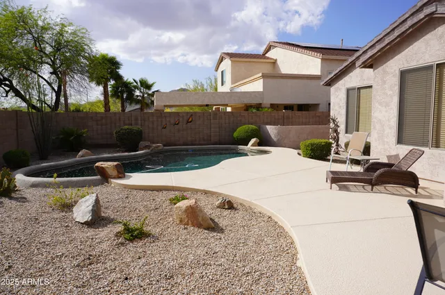 a view of a entryway door with dining room and furniture