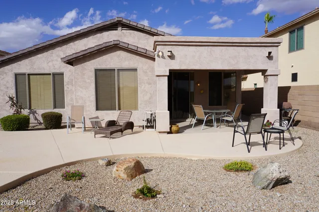 a view of a dining room with furniture and a window