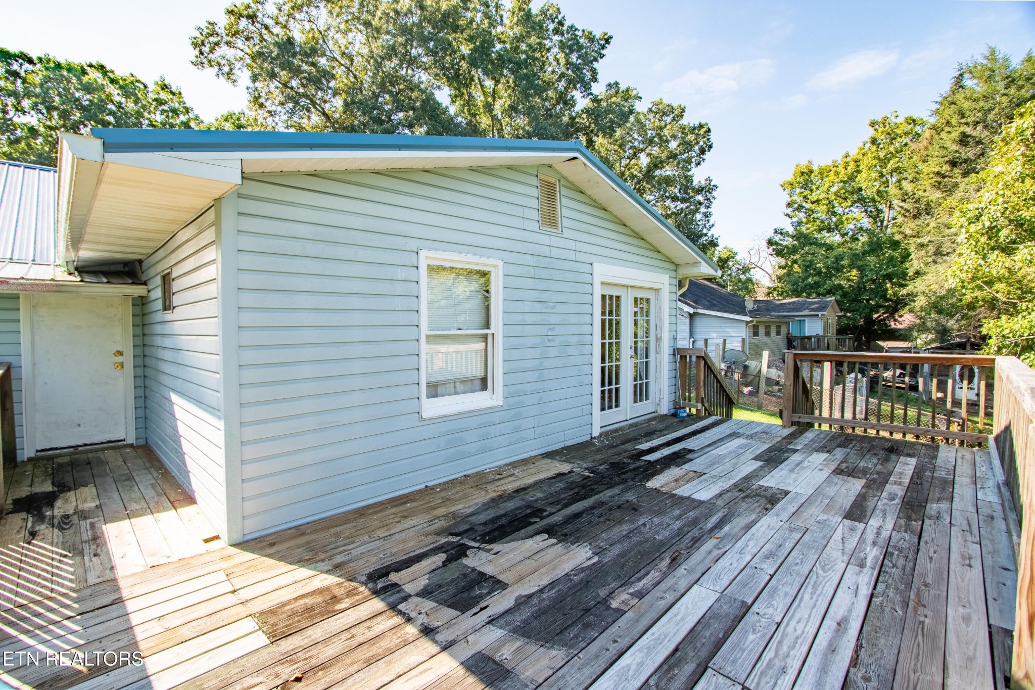 2316 Reservoir Road Kingsport, TN 37660 - Photo 13 of 22 a view of a wooden deck with a bench