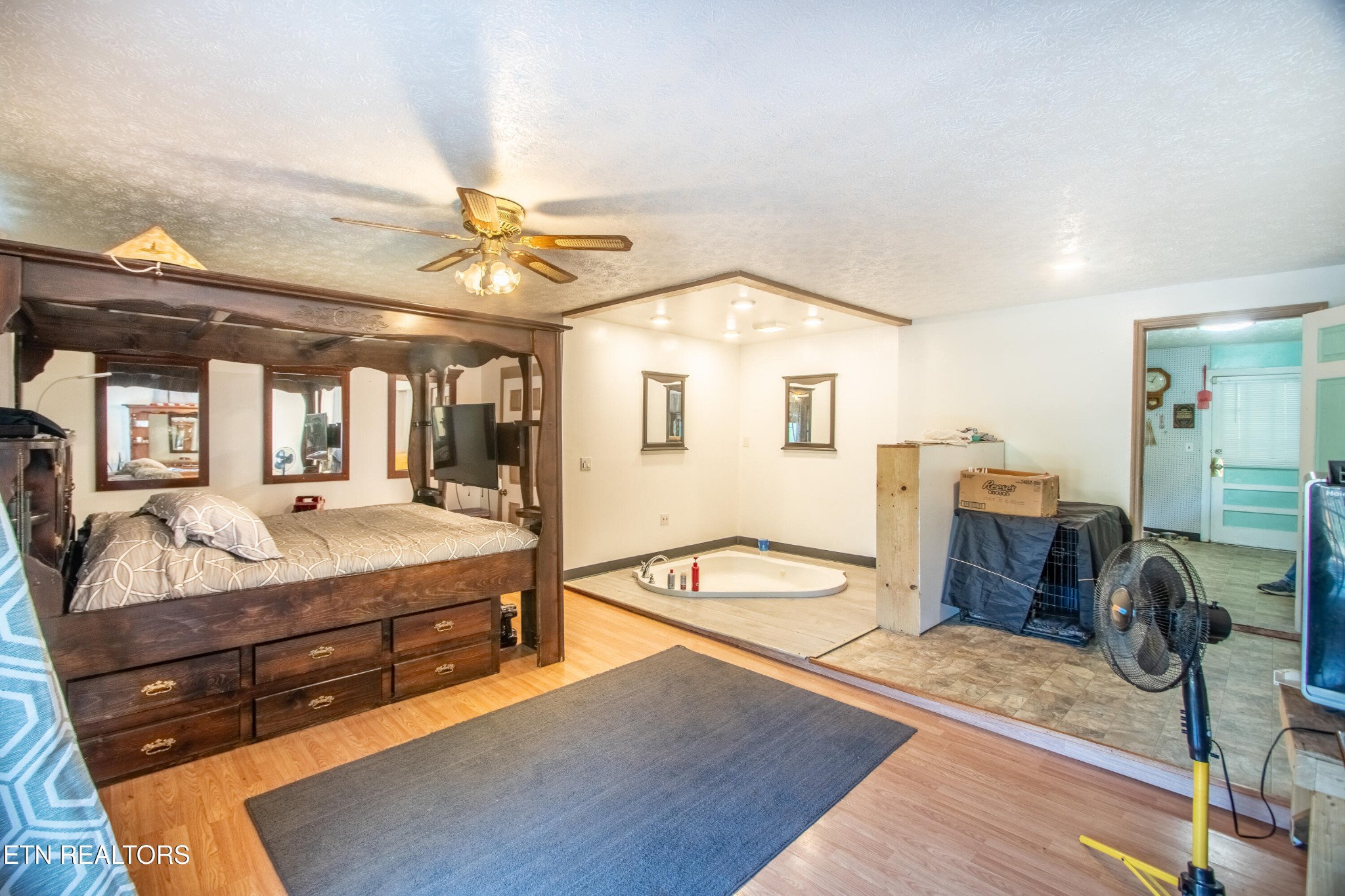 2316 Reservoir Road Kingsport, TN 37660 - Photo 7 of 22 a spacious bedroom with a bed and wooden floor
