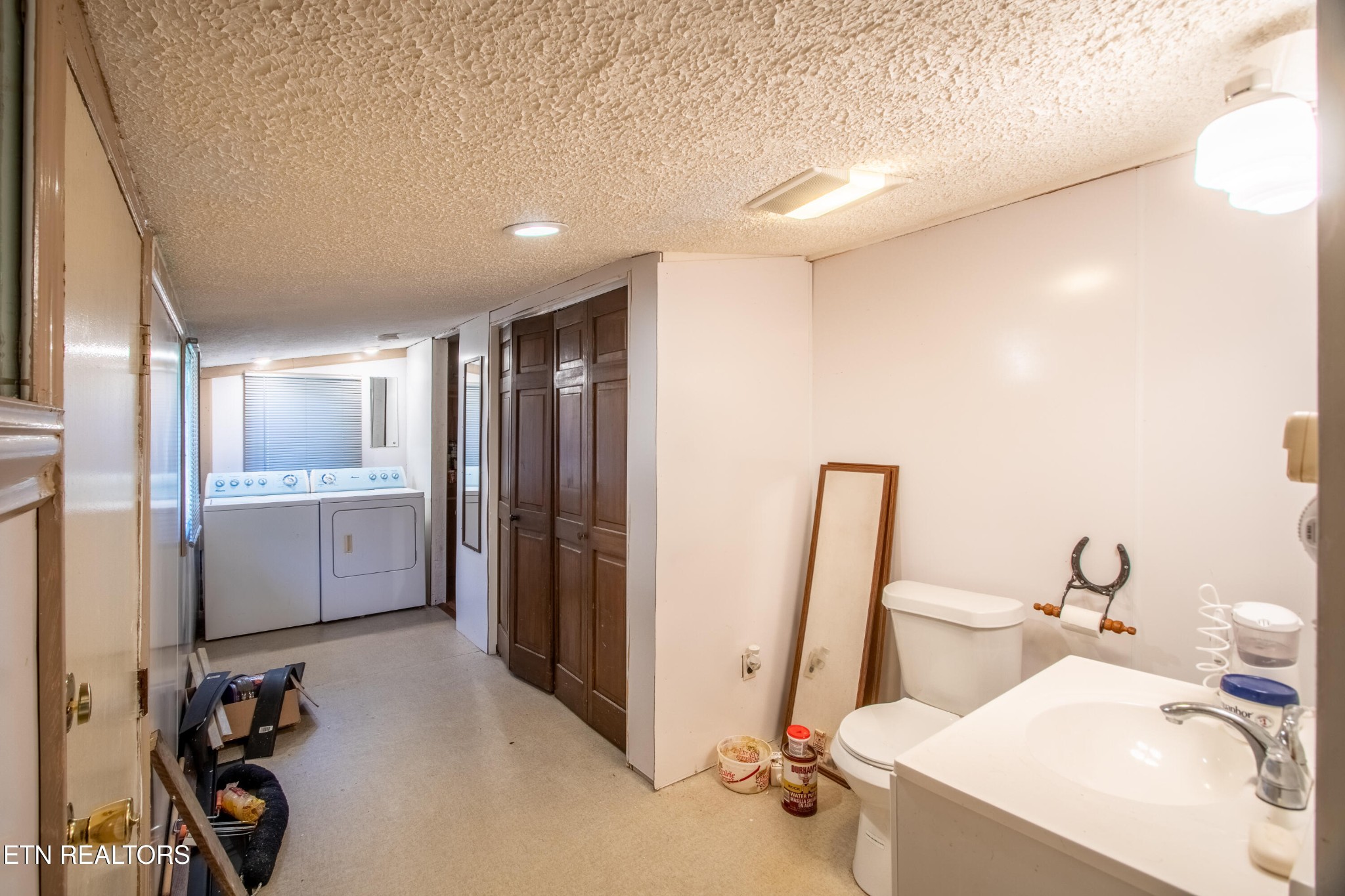 2316 Reservoir Road Kingsport, TN 37660 - Photo 9 of 22 a bathroom with a sink a toilet and shower