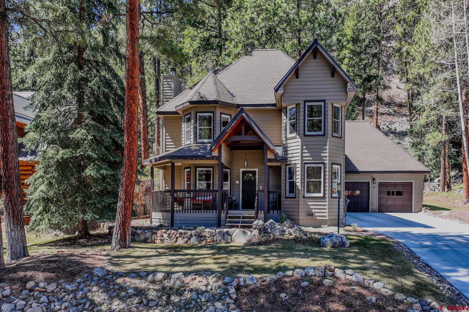 34 Crocus Court Durango, CO 81301 - Photo 1 of 30 a front view of a house with garden