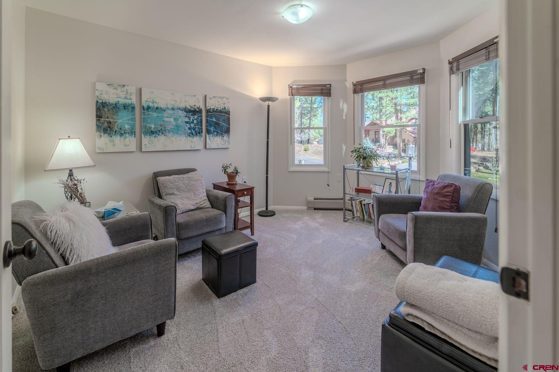34 Crocus Court Durango, CO 81301 - Photo 13 of 30 a living room with furniture and a window