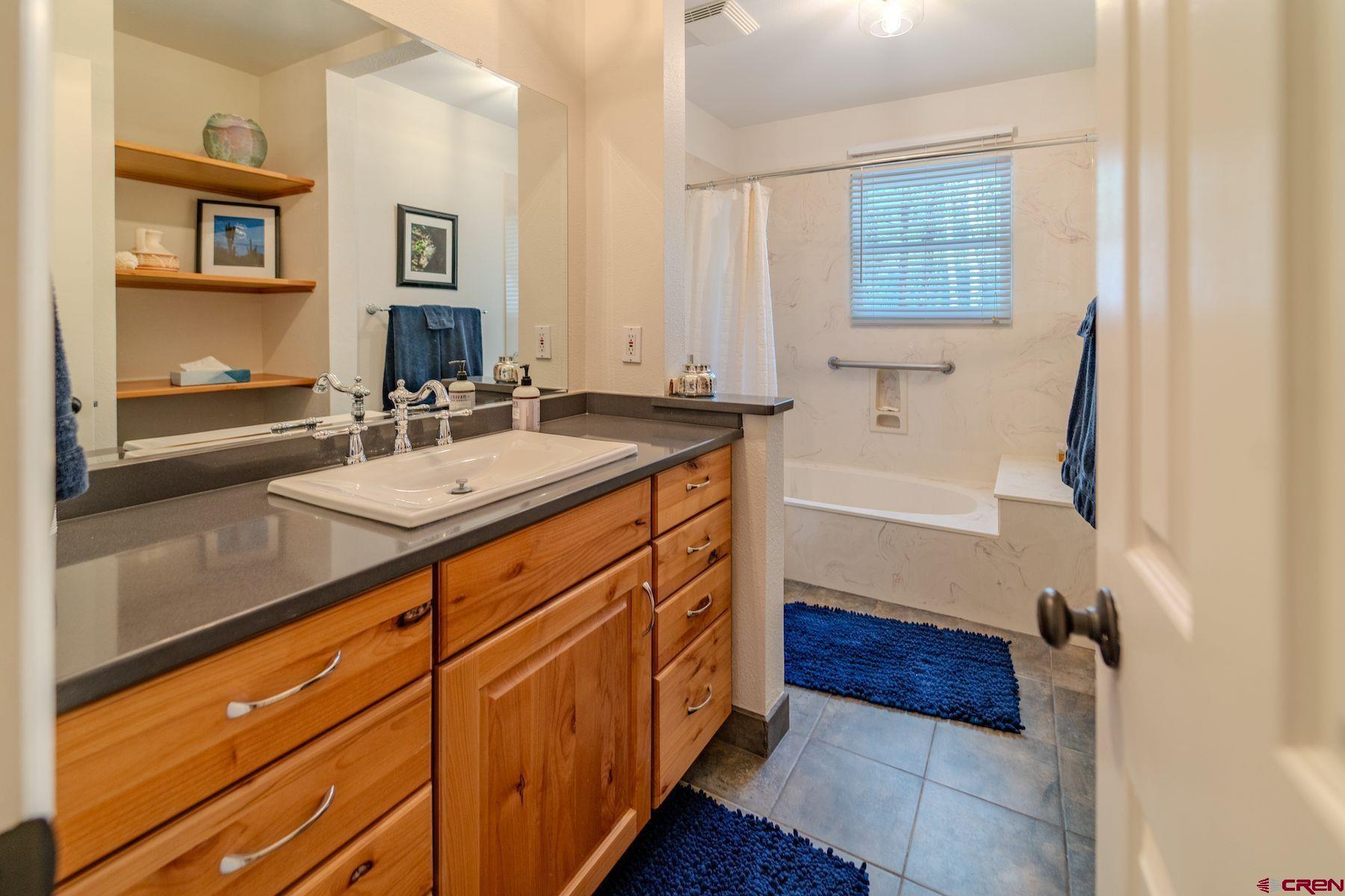 34 Crocus Court Durango, CO 81301 - Photo 22 of 30 a bathroom with a sink and a mirror