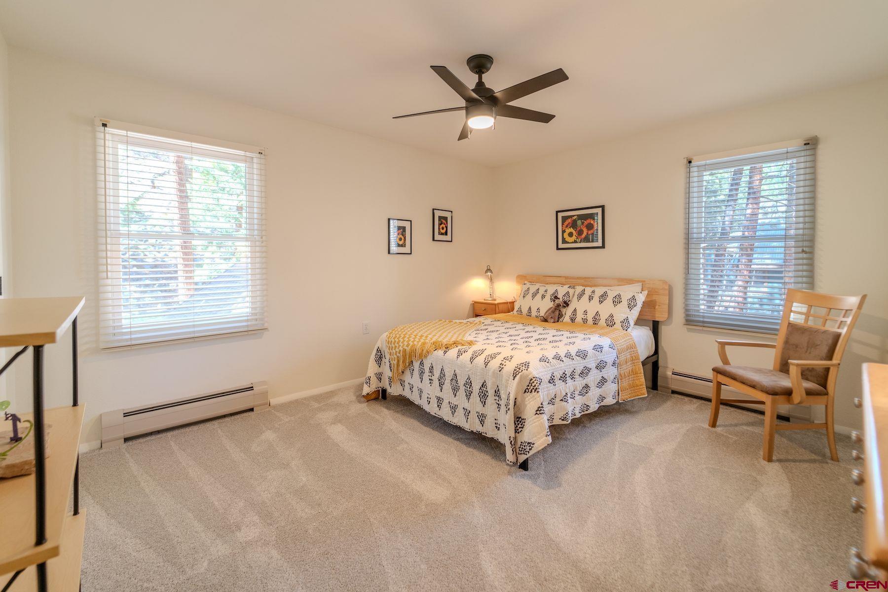 34 Crocus Court Durango, CO 81301 - Photo 24 of 30 a living room with a bed furniture and a window
