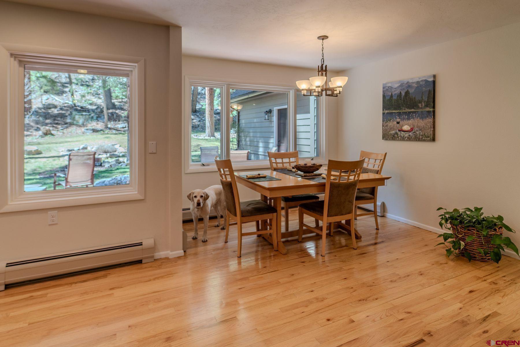 34 Crocus Court Durango, CO 81301 - Photo 25 of 30 a view of a dining room with furniture window and wooden floor