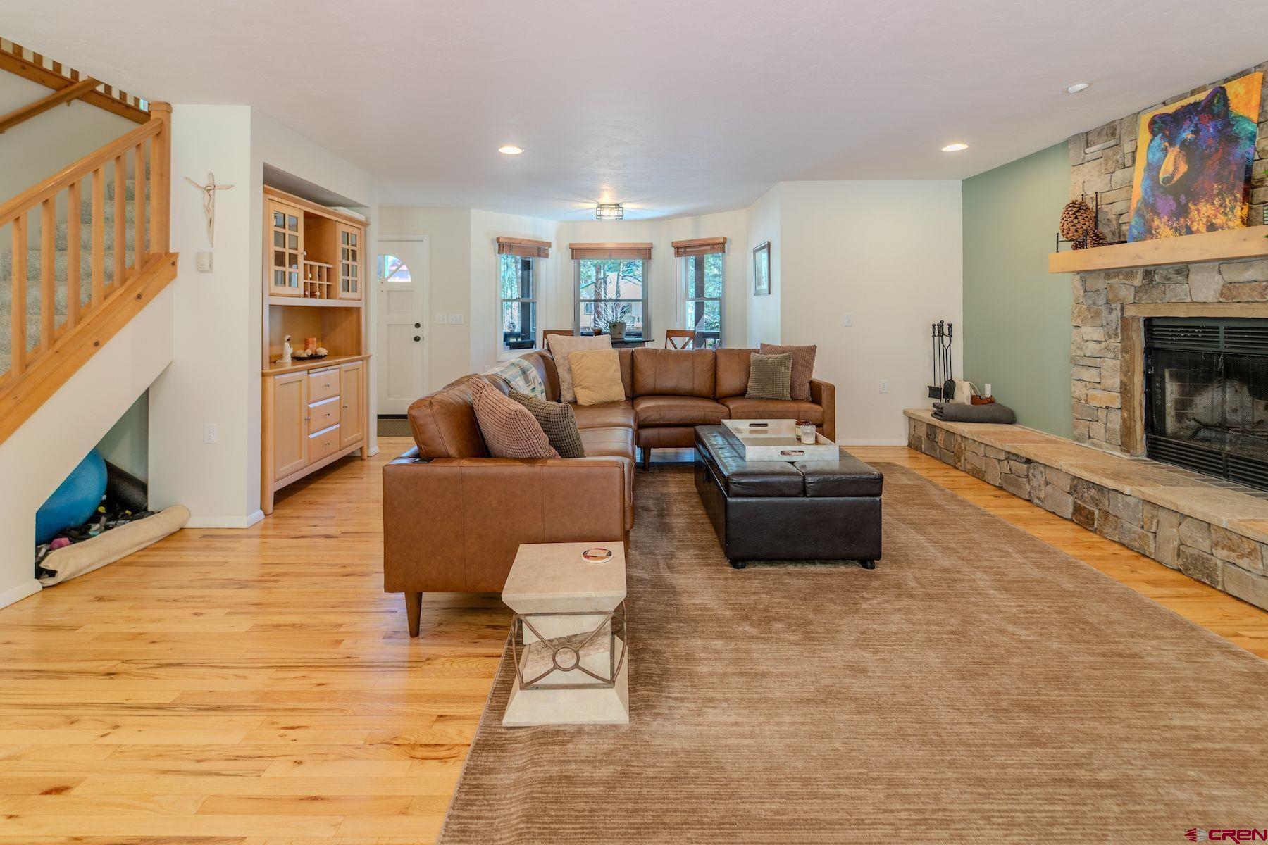 34 Crocus Court Durango, CO 81301 - Photo 3 of 30 a living room with furniture and a fireplace