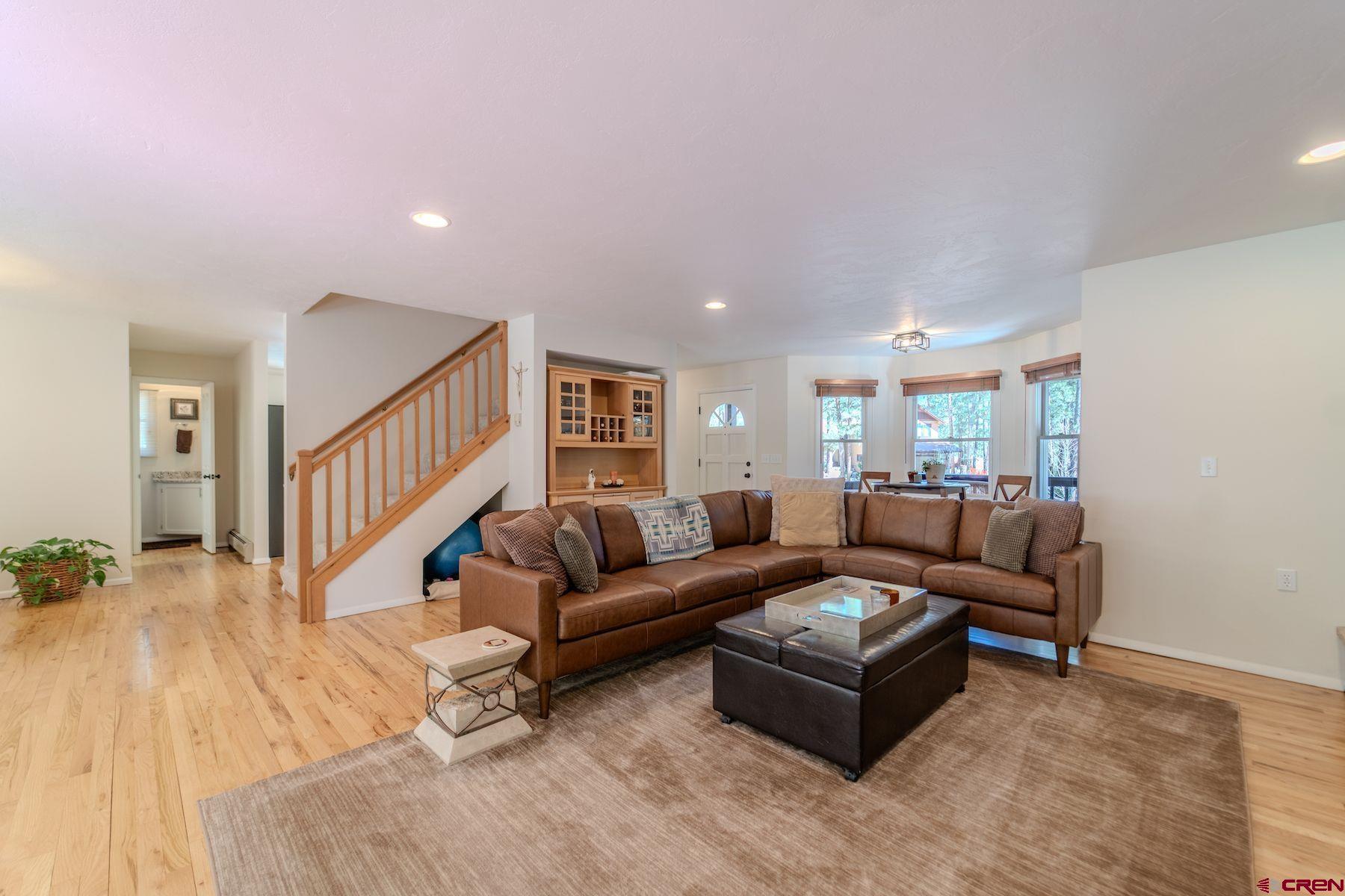 34 Crocus Court Durango, CO 81301 - Photo 5 of 30 a living room with a couch and a wooden floor