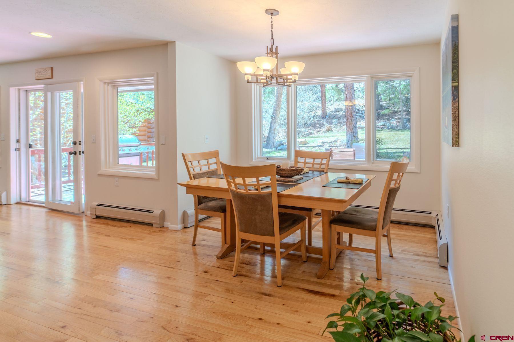 34 Crocus Court Durango, CO 81301 - Photo 6 of 30 a dining room with furniture window wooden floor