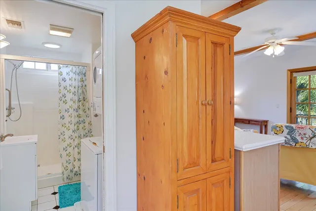 a bathroom with a glass shower door
