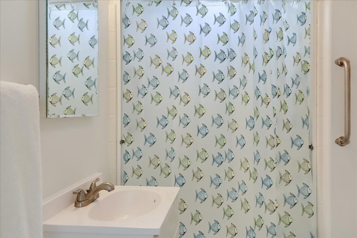 0 Mountain Avenue Santa Barbara, CA 93101 - Photo 24 of 24 a bathroom with a sink and a mirror