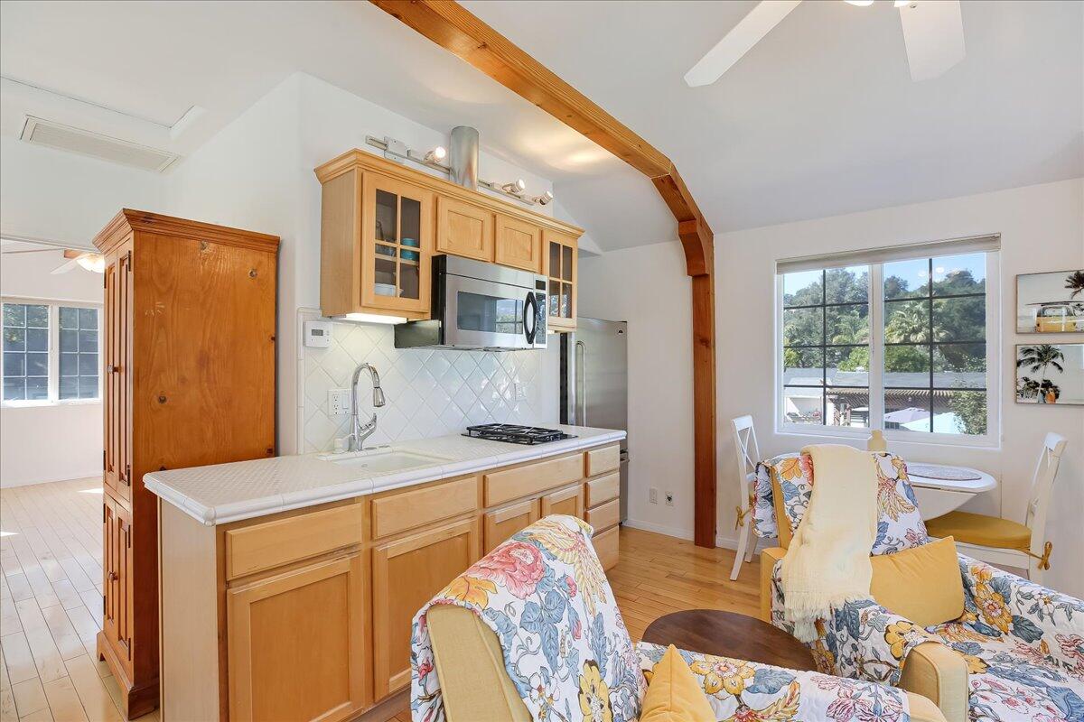 0 Mountain Avenue Santa Barbara, CA 93101 - Photo 7 of 24 a living room with stainless steel appliances furniture a rug and a large window