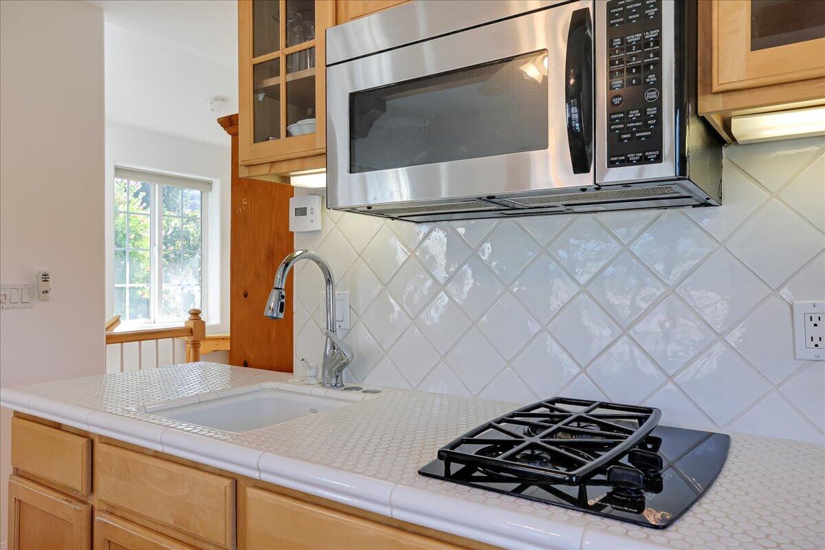 0 Mountain Avenue Santa Barbara, CA 93101 - Photo 9 of 24 a kitchen with a stove and a microwave