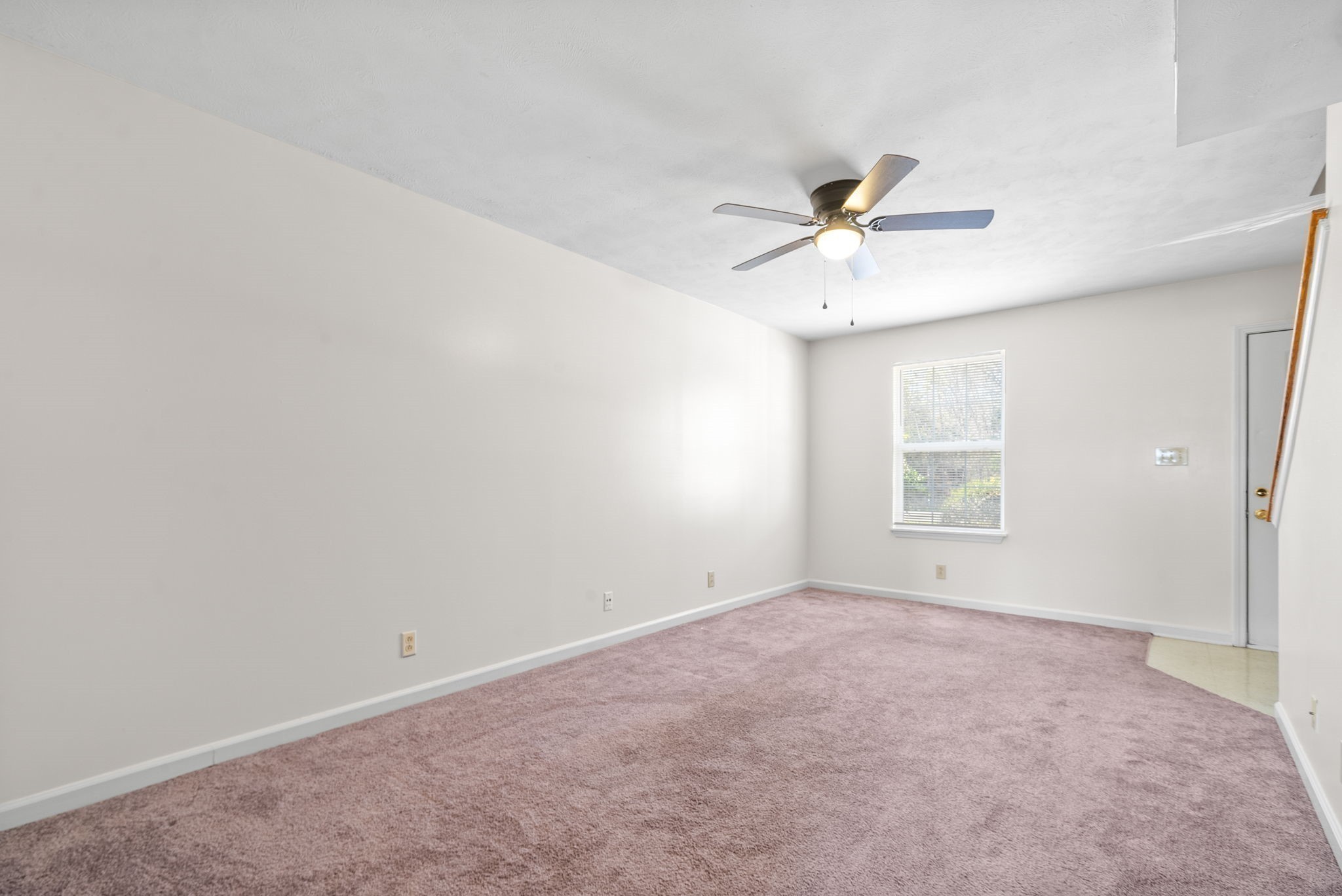 630 Needmore Road, Unit C Clarksville, TN 37040 - Photo 7 of 24 an empty room with a window and a ceiling fan