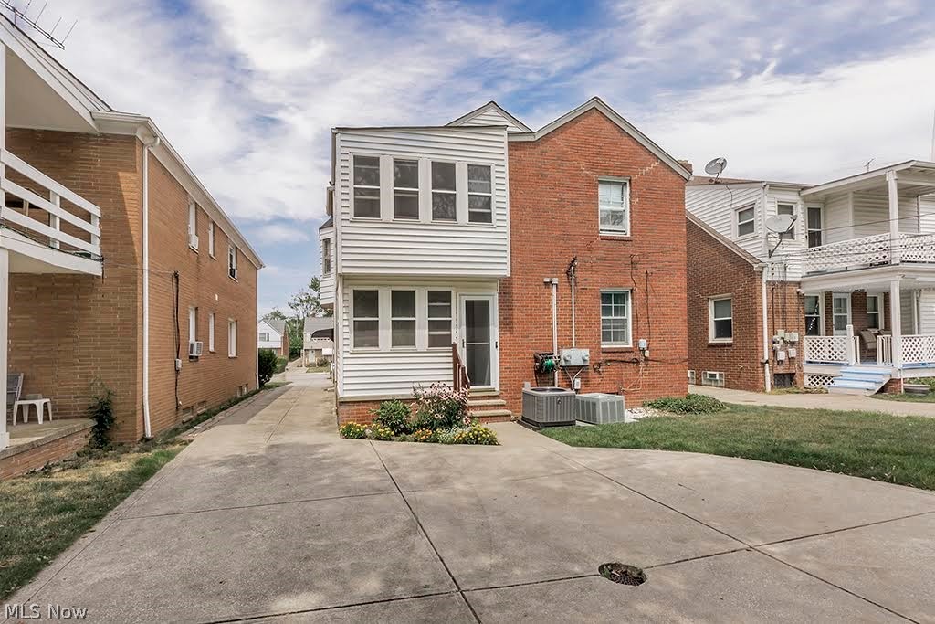 13582 Cedar Road Cleveland, OH 44118 - Photo 2 of 42 Back of house showing first and second floor sunrooms