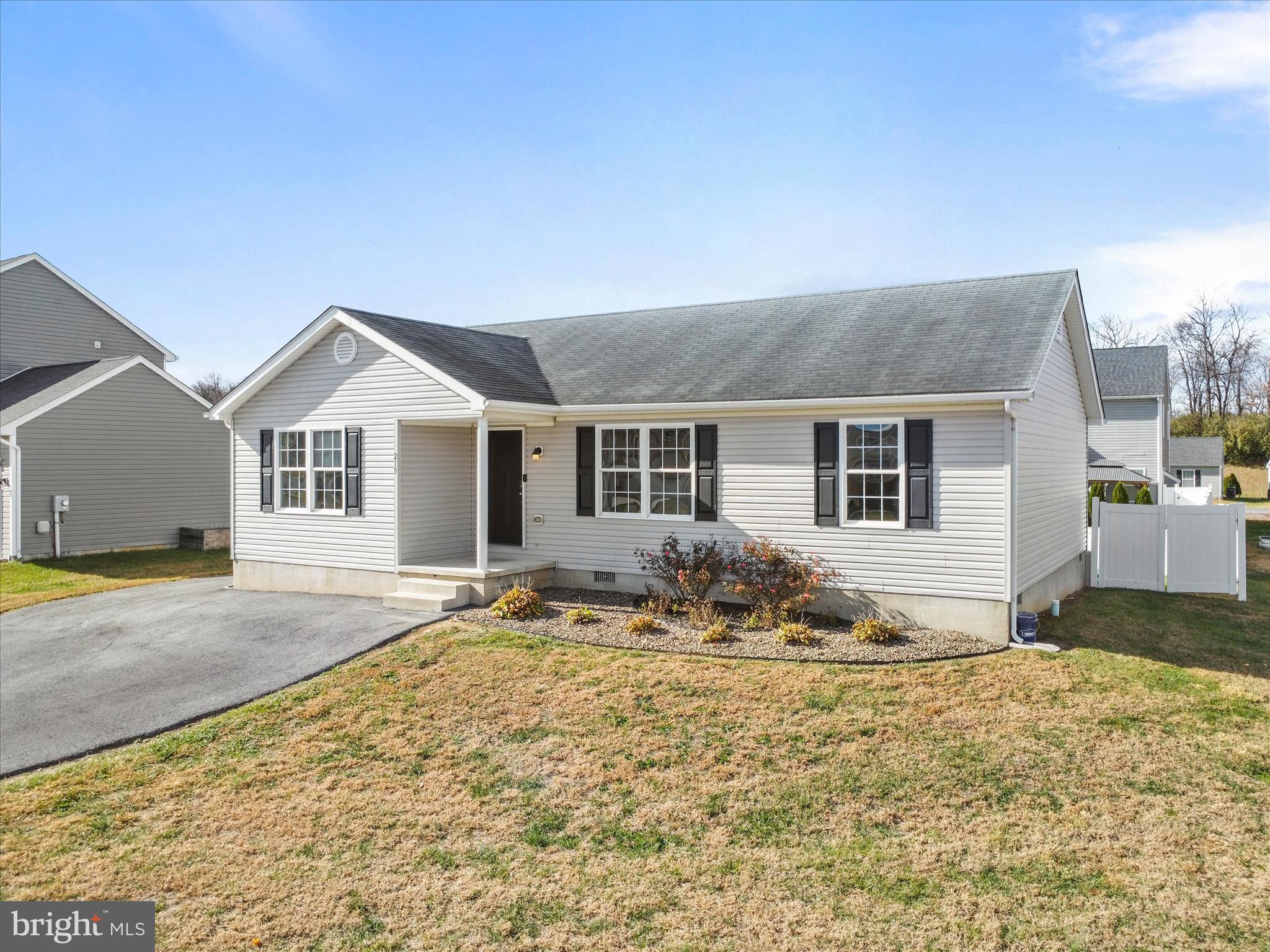 219 Job Road Inwood, WV 25428 - Photo 3 of 29 a front view of a house with a outdoor space