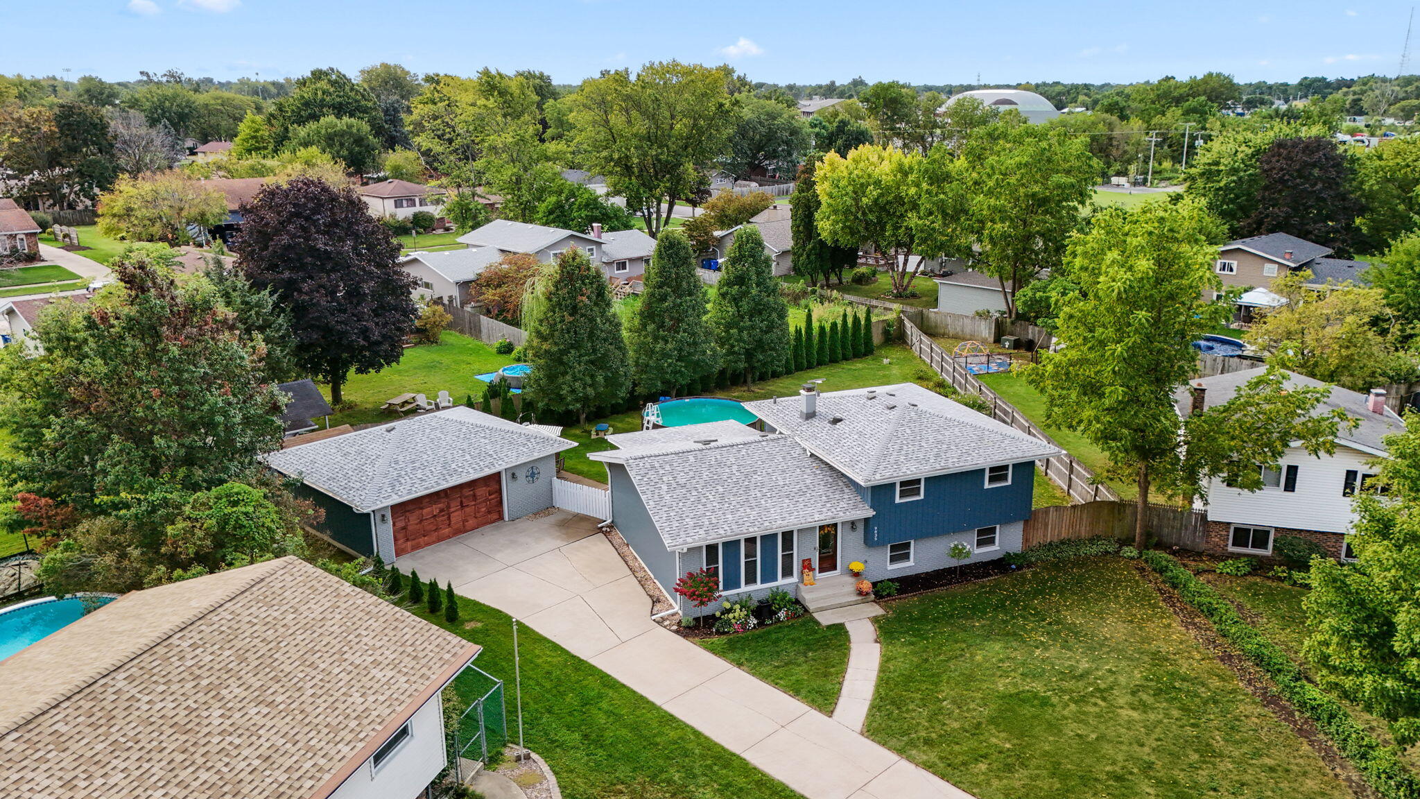 9835 Arthur Court Crown Point, IN 46307 - Photo 26 of 27 an aerial view of a house with swimming pool and garden