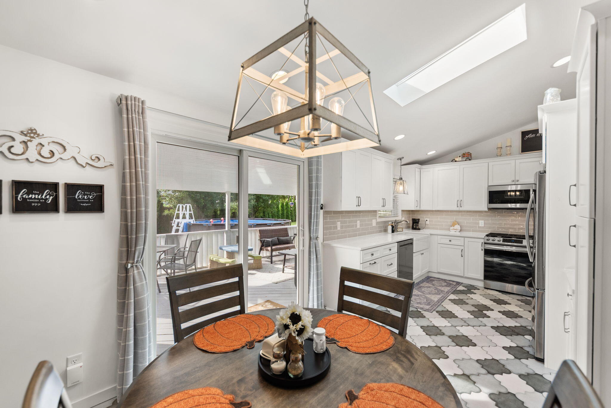 9835 Arthur Court Crown Point, IN 46307 - Photo 7 of 27 a kitchen with stainless steel appliances kitchen island granite countertop a refrigerator and a stove top oven