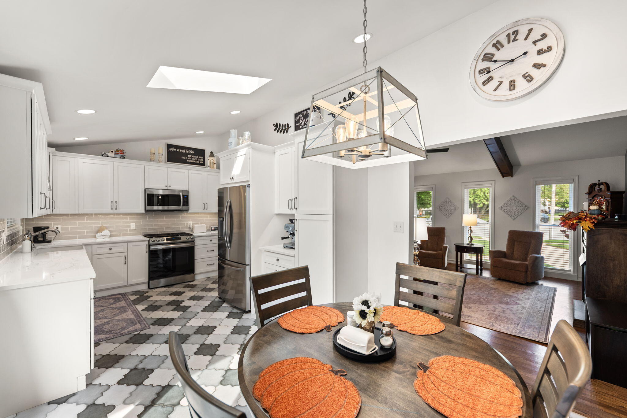 9835 Arthur Court Crown Point, IN 46307 - Photo 8 of 27 a open dining room with furniture a kitchen and chandelier