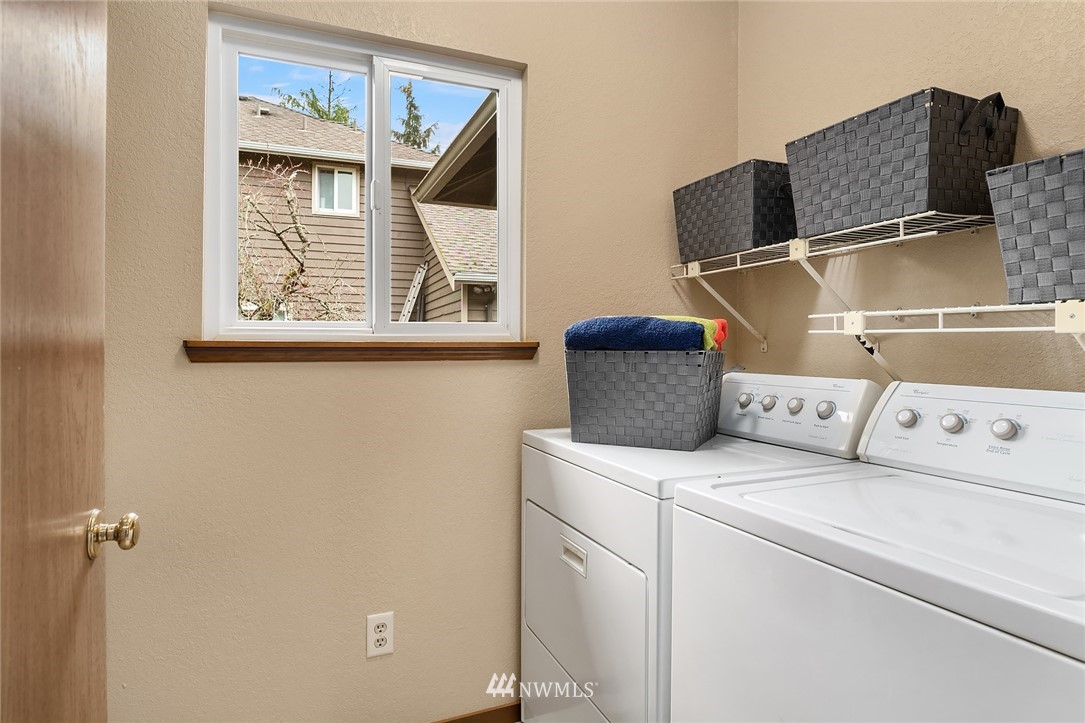 29 236th Place Southwest Bothell, WA 98021 - Photo 33 of 36 a utility room with dryer and washer