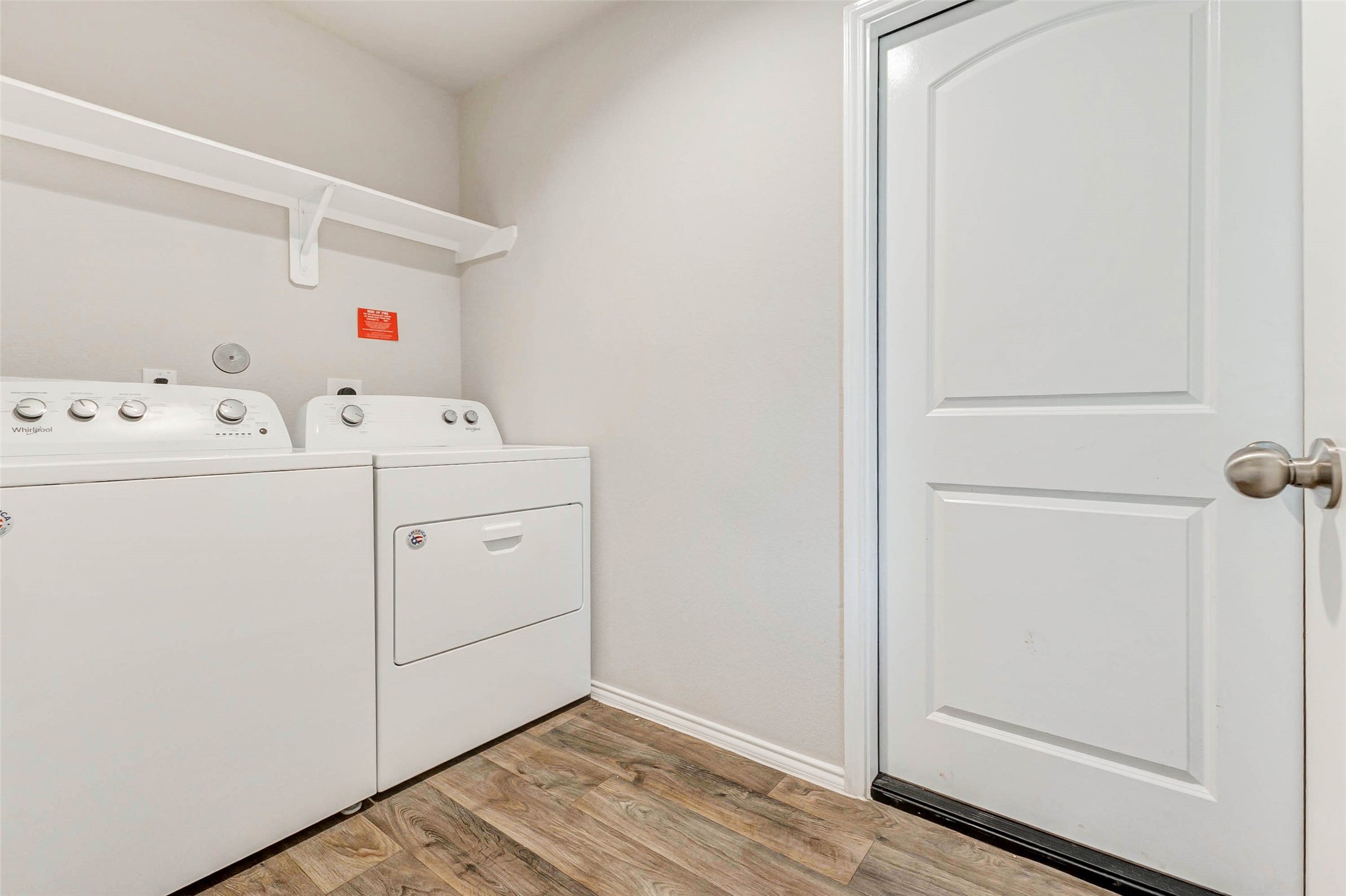 23135 Barrington Bluff Trail Spring, TX 77373 - Photo 13 of 15 a view of washer and dryer with wooden floor