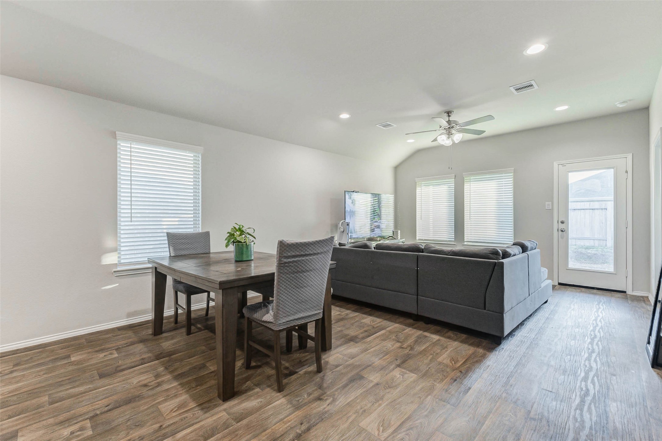 23135 Barrington Bluff Trail Spring, TX 77373 - Photo 6 of 15 a living room with furniture a wooden floor and a sink