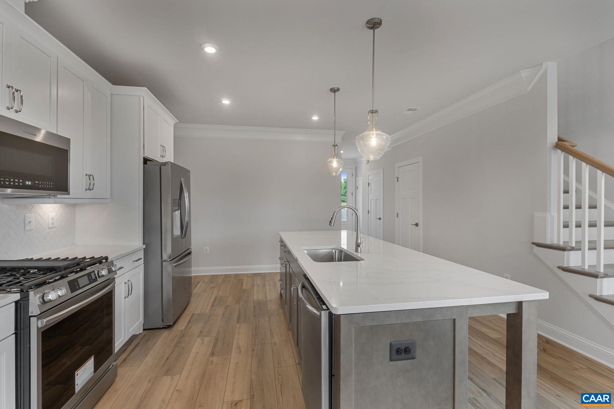 201 Ridgeline Drive Waynesboro, VA 22980 - Photo 16 of 45 a kitchen with kitchen island a sink appliances a counter space and cabinets