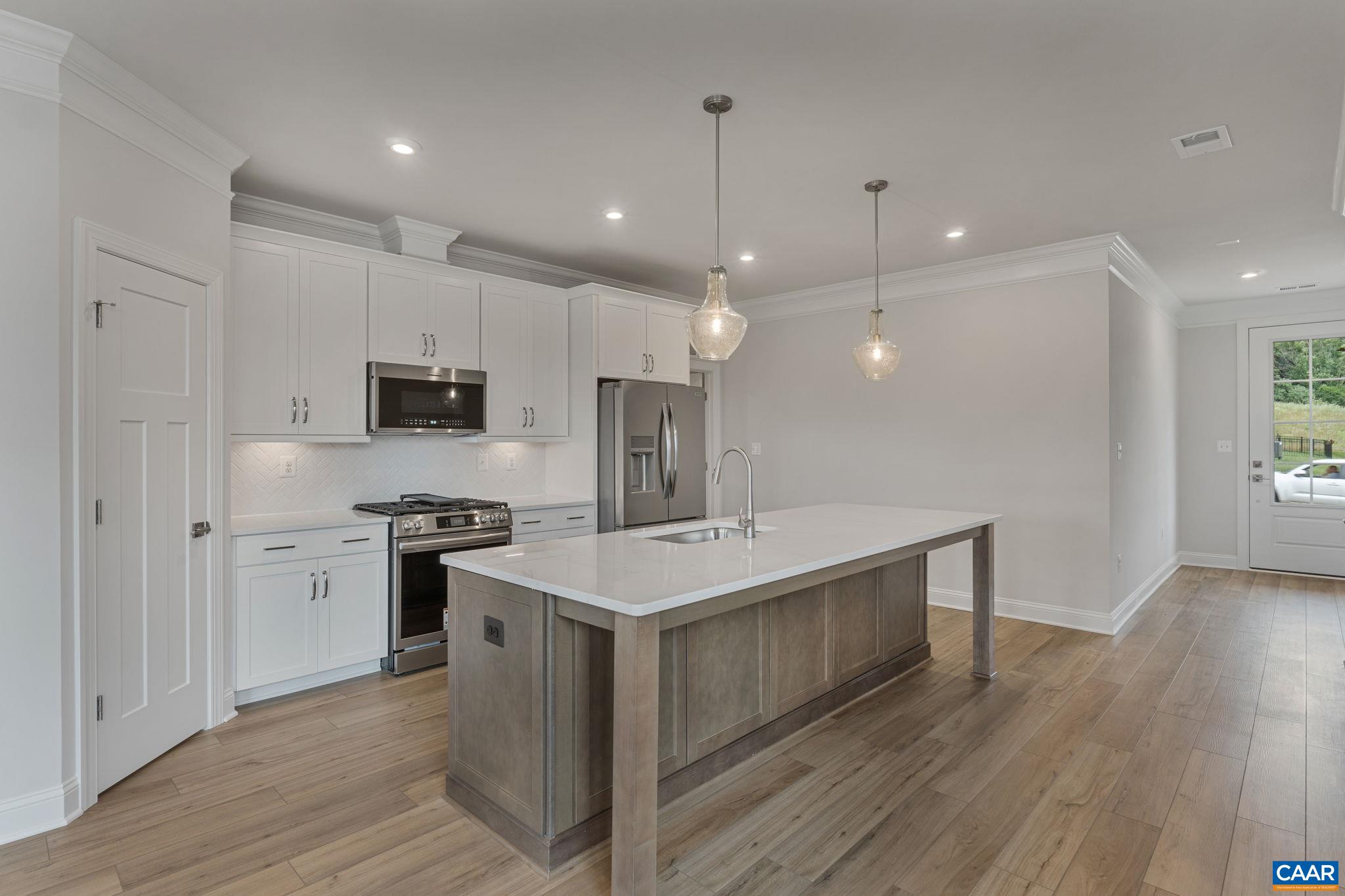 201 Ridgeline Drive Waynesboro, VA 22980 - Photo 17 of 45 a kitchen with stainless steel appliances a sink stove refrigerator and cabinets