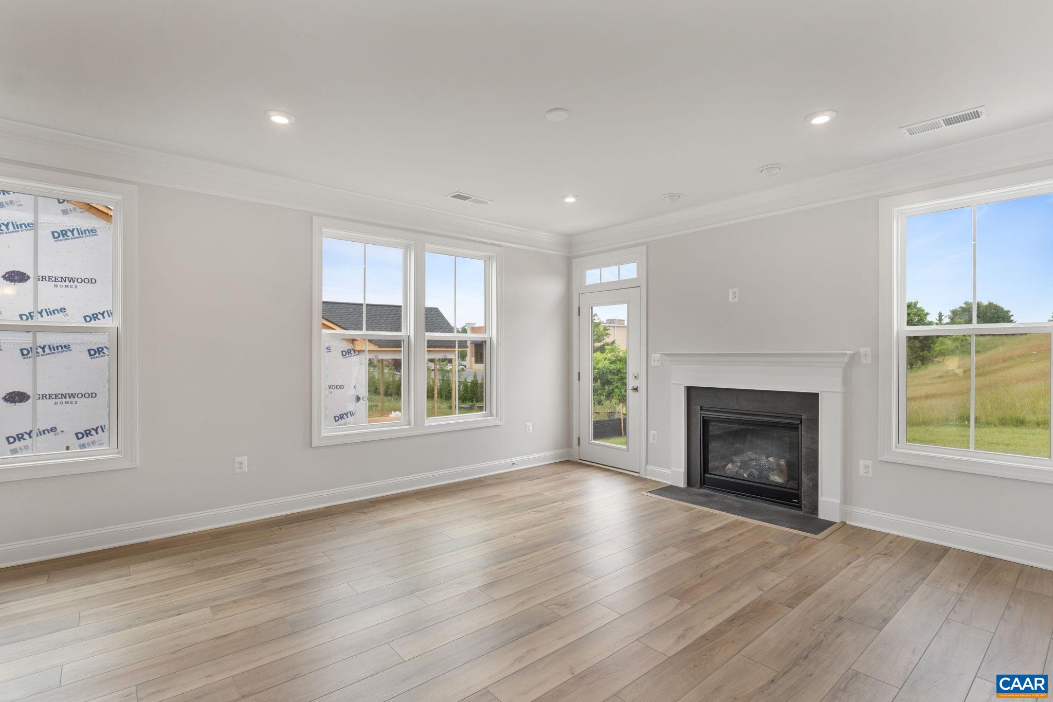 201 Ridgeline Drive Waynesboro, VA 22980 - Photo 20 of 45 a view of an empty room with wooden floor fireplace and a window