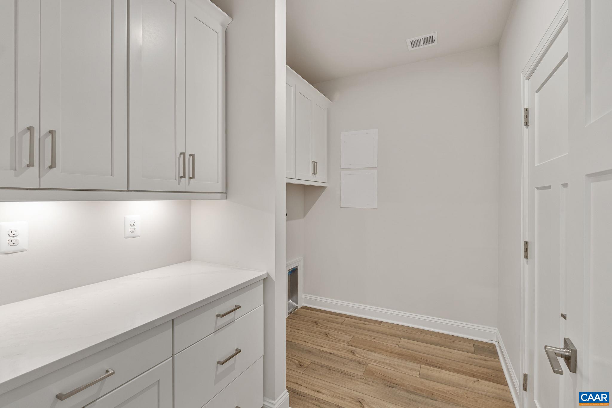 201 Ridgeline Drive Waynesboro, VA 22980 - Photo 22 of 45 a kitchen with white cabinets and a sink