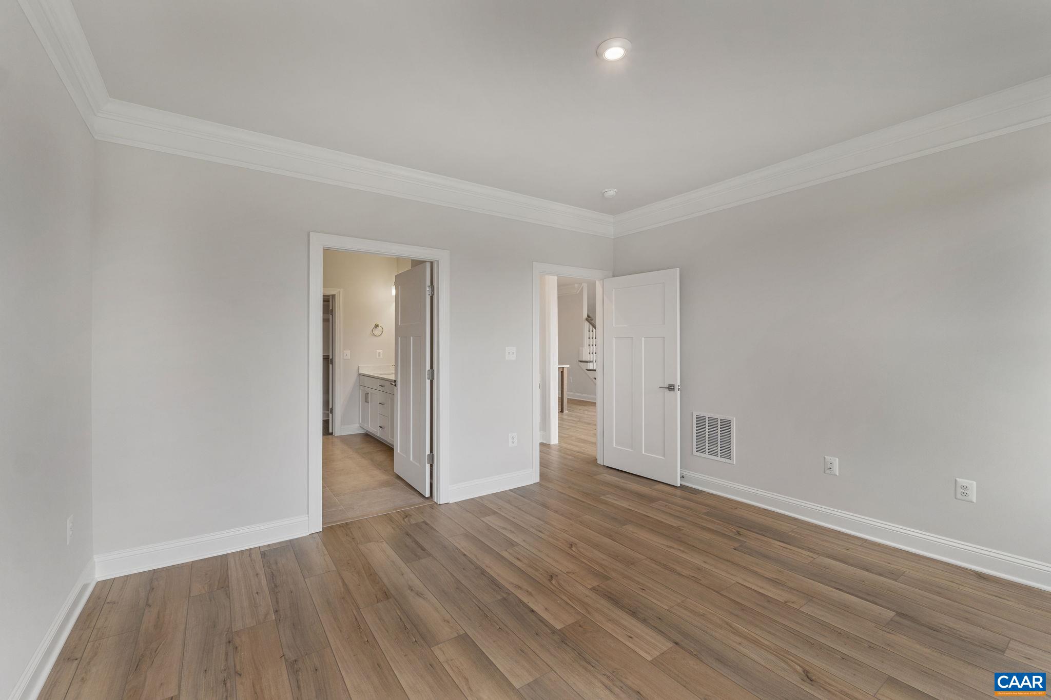 201 Ridgeline Drive Waynesboro, VA 22980 - Photo 26 of 45 a view of an empty room with wooden floor and closet