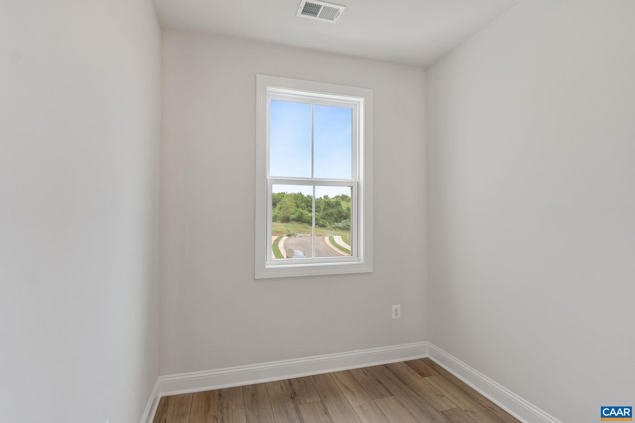 201 Ridgeline Drive Waynesboro, VA 22980 - Photo 37 of 45 a view of an empty room with wooden floor and a window