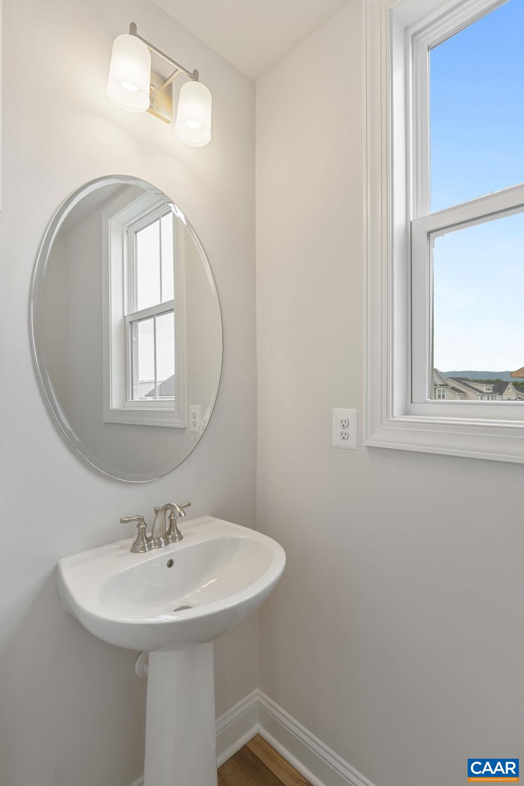 201 Ridgeline Drive Waynesboro, VA 22980 - Photo 7 of 45 a bathroom with a sink a mirror and a window