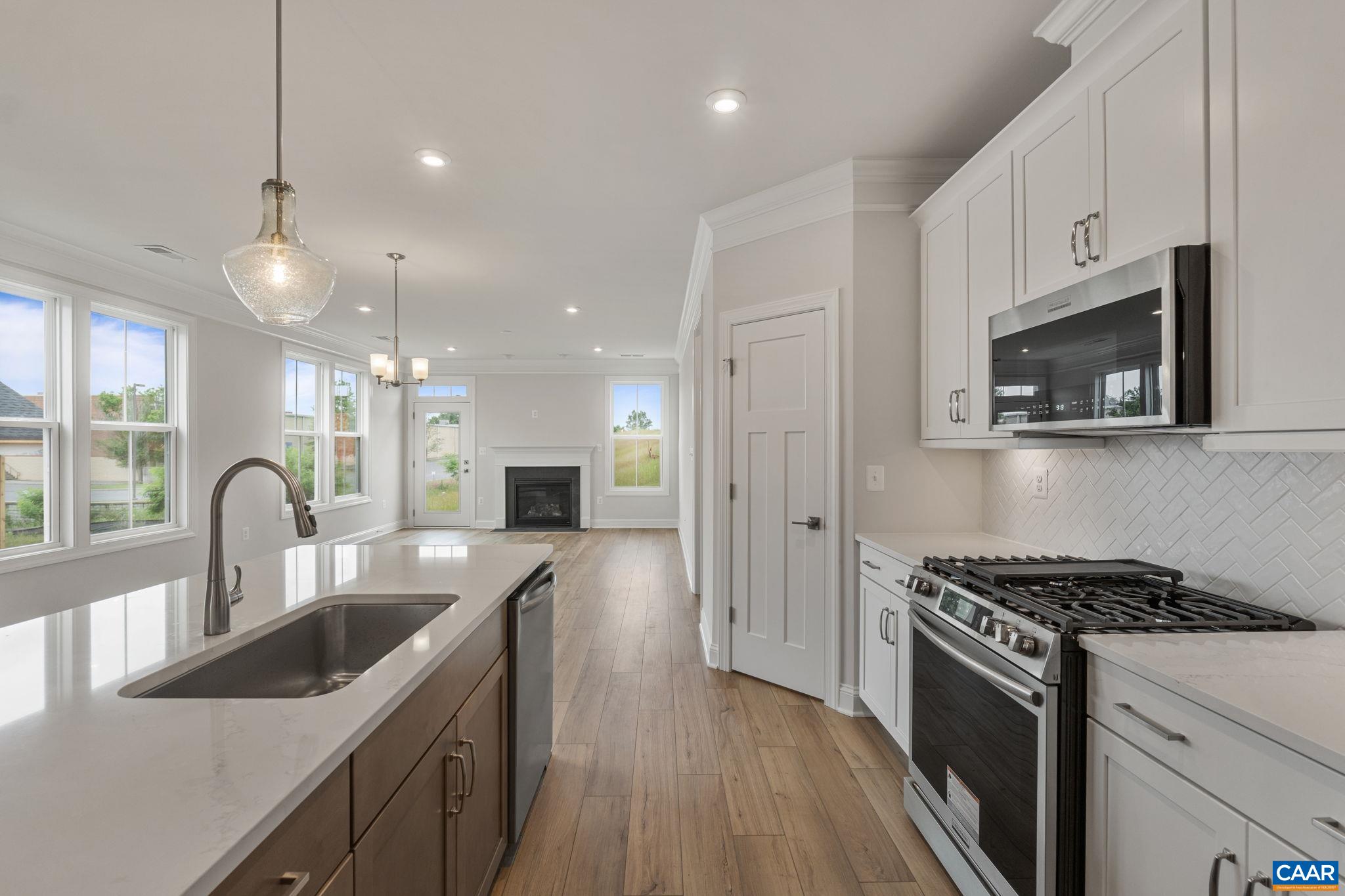 201 Ridgeline Drive Waynesboro, VA 22980 - Photo 10 of 45 a kitchen with stainless steel appliances a sink a stove top oven a counter space and cabinets