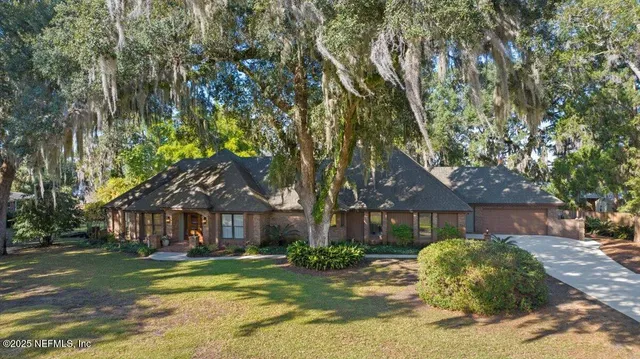 a living room with furniture a window and a fireplace
