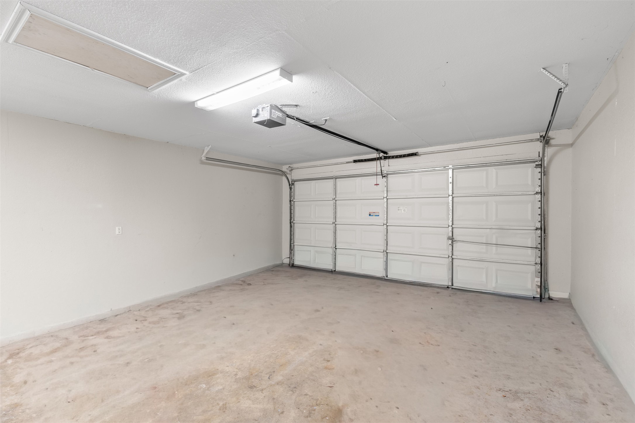 2602 Peach Tree Lane Cedar Park, TX 78613 - Photo 13 of 14 Garage featuring a garage door opener