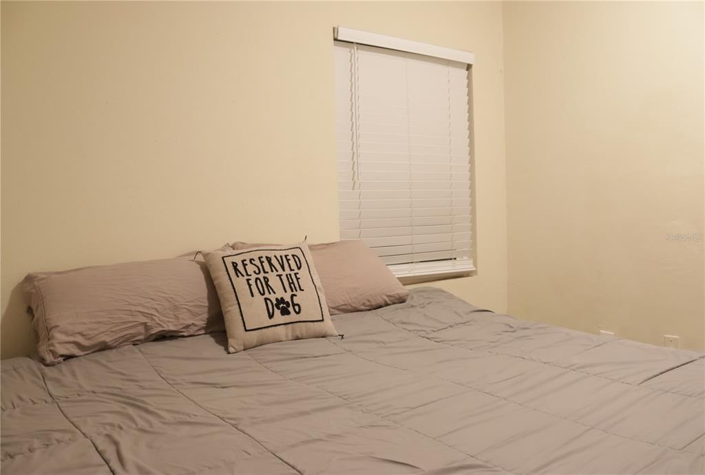 3856 South Sandpiper Terrace Homosassa, FL 34448 - Photo 17 of 27 a bedroom with a bed and a window