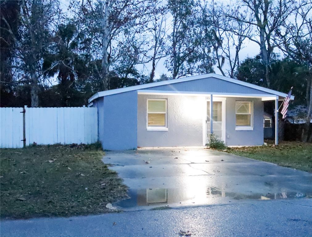 3856 South Sandpiper Terrace Homosassa, FL 34448 - Photo 2 of 27 a front view of a house with a yard