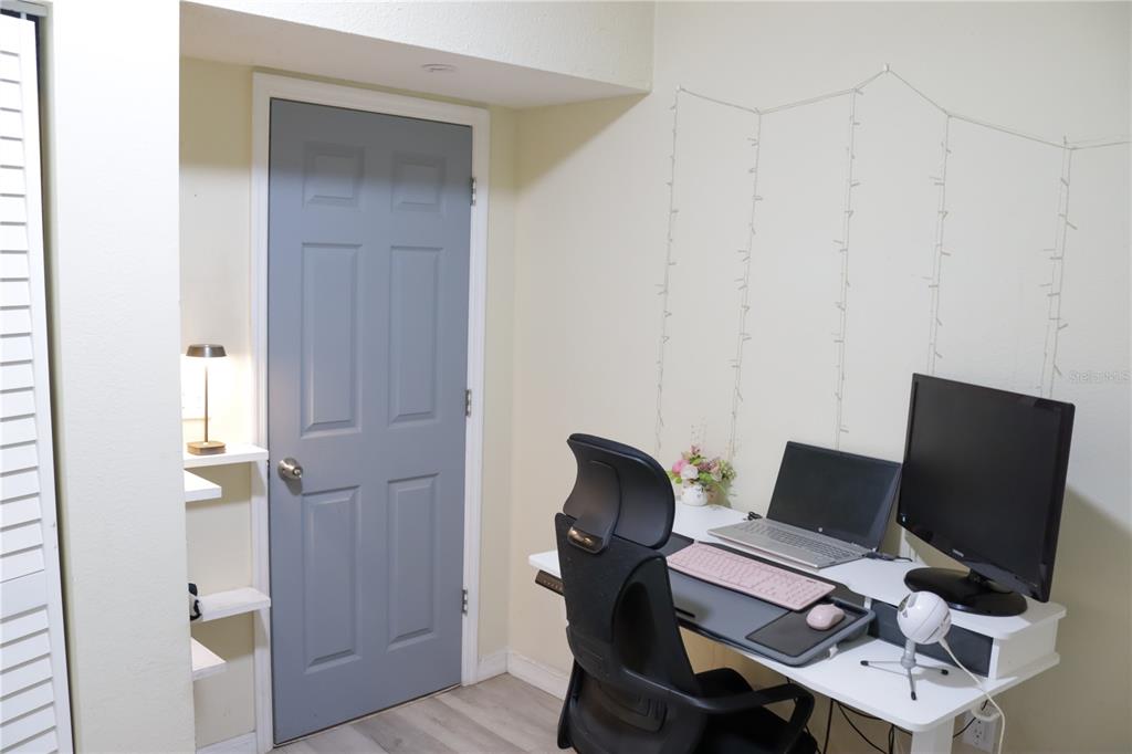 3856 South Sandpiper Terrace Homosassa, FL 34448 - Photo 25 of 27 a view of a workspace with furniture and wooden floor