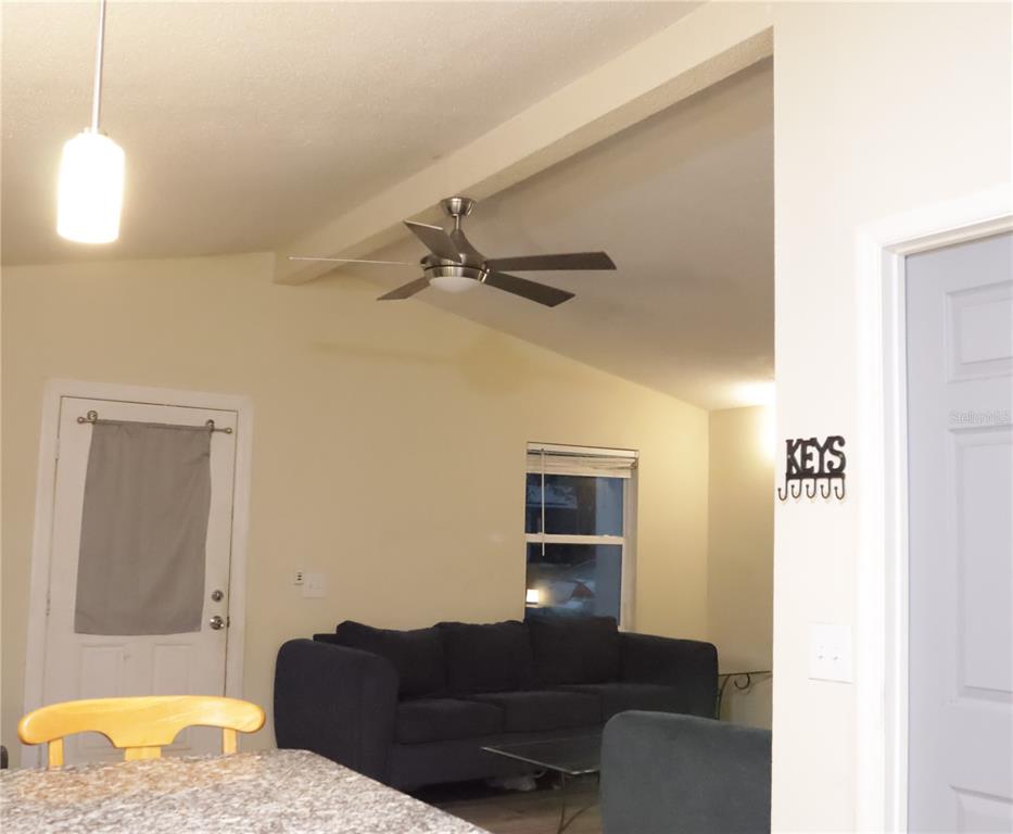 3856 South Sandpiper Terrace Homosassa, FL 34448 - Photo 7 of 27 a living room with furniture and a window