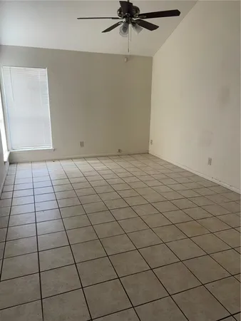 a view of a livingroom and window