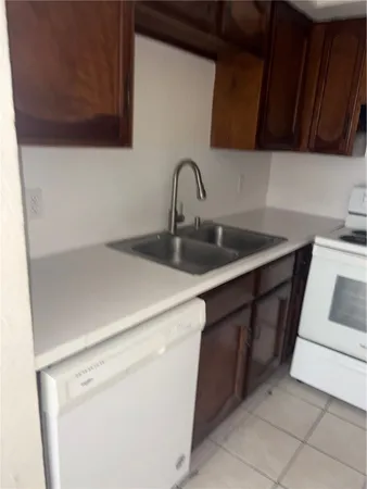 a kitchen with a sink and cabinets