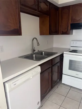 a kitchen with a stove and a microwave