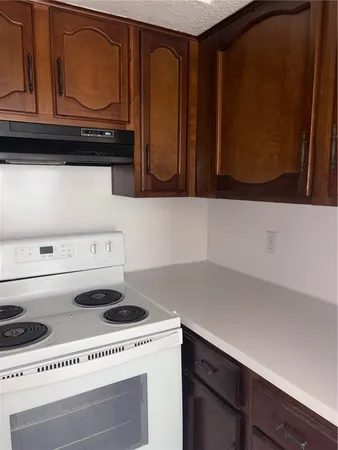 a view of a backyard with wooden fence