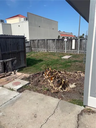 a view of a pathway with a garden
